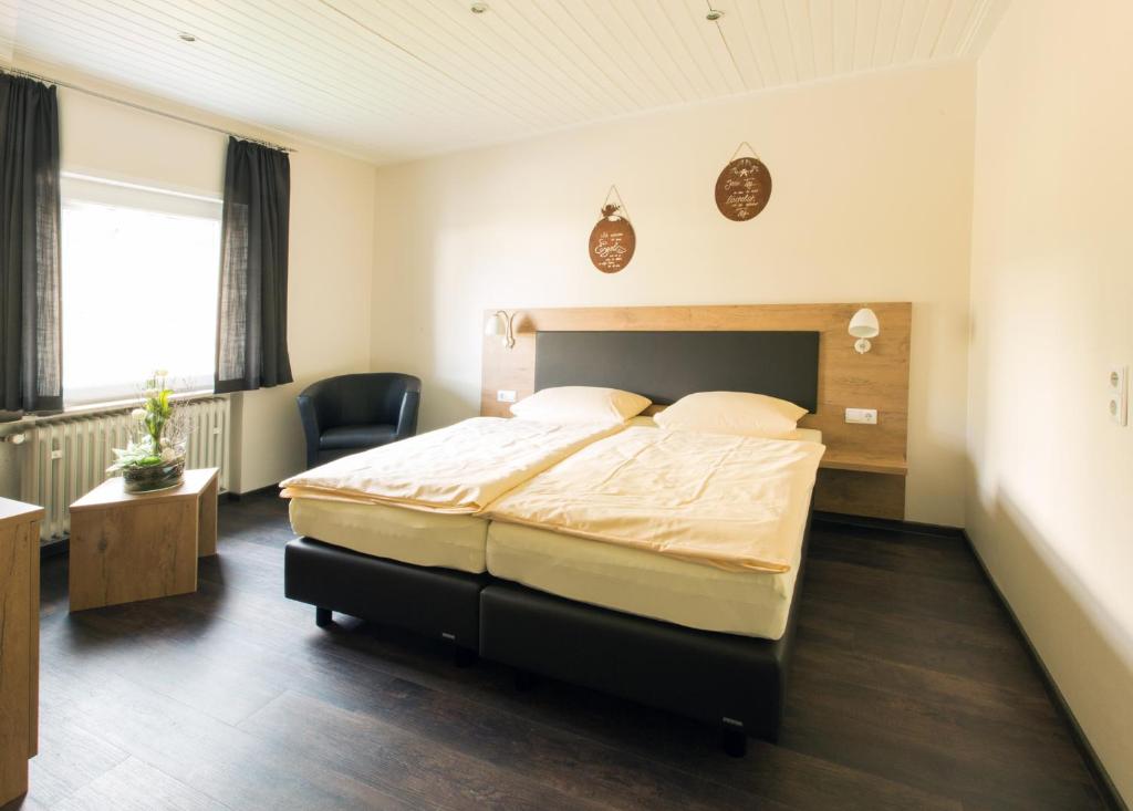 Postel nebo postele na pokoji v ubytování Hotel Kupper