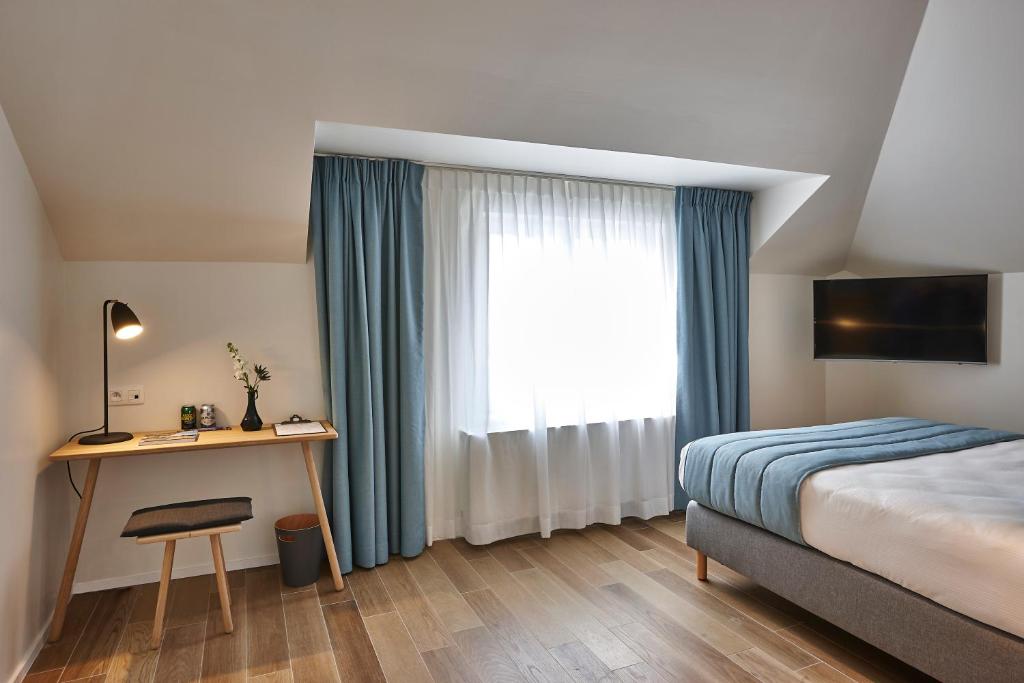 Postel nebo postele na pokoji v ubytování Hygge Hotel