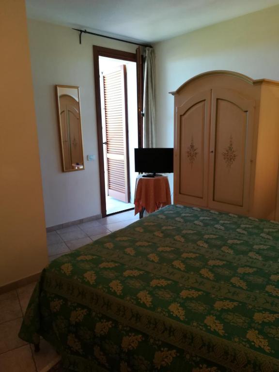 Postel nebo postele na pokoji v ubytování Villa Loreto