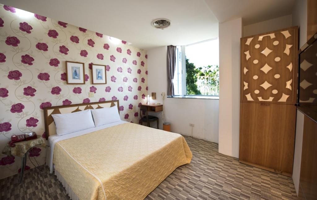 Postel nebo postele na pokoji v ubytování Songyuan B&B