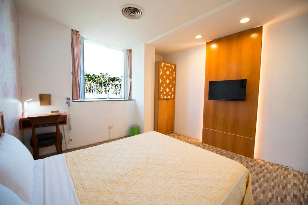 Postel nebo postele na pokoji v ubytování Songyuan B&B