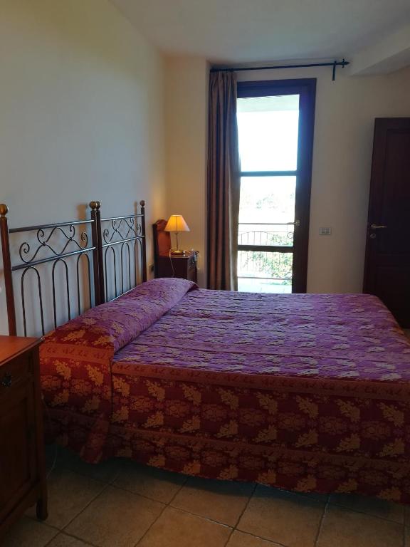 Postel nebo postele na pokoji v ubytování Villa Loreto