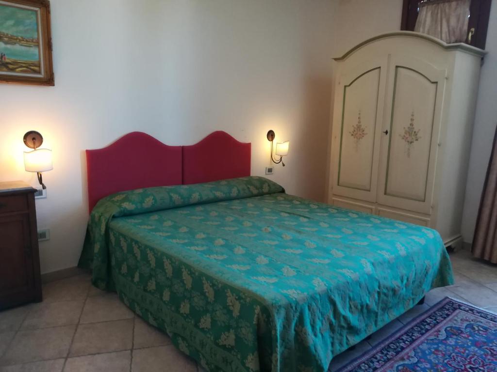 Postel nebo postele na pokoji v ubytování Villa Loreto