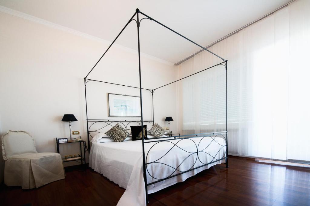 Postel nebo postele na pokoji v ubytování Grand Hotel Passetto