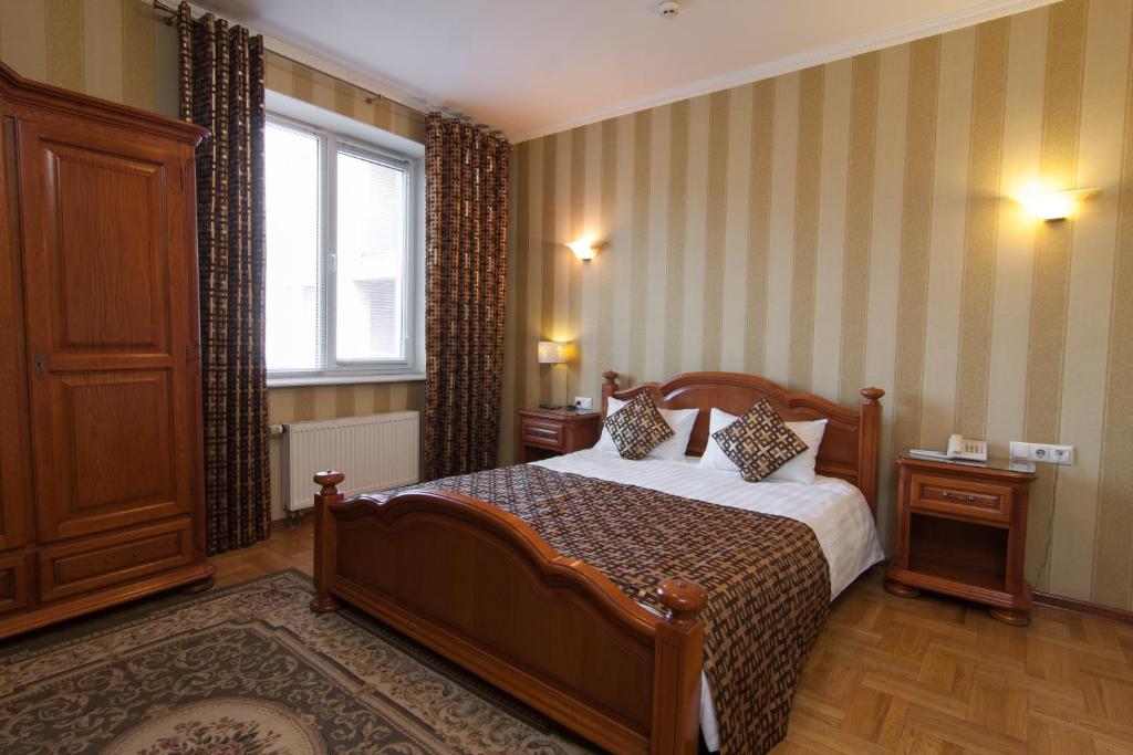 Postel nebo postele na pokoji v ubytování Klassik Hotel