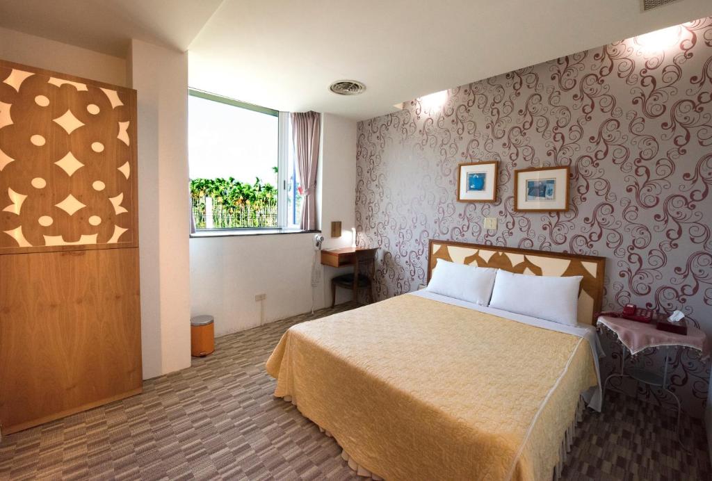 Postel nebo postele na pokoji v ubytování Songyuan B&B