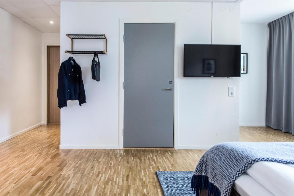 TV a/nebo společenská místnost v ubytování Biz Apartment Solna