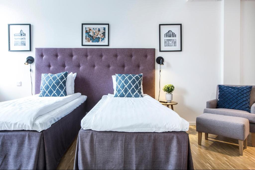 Postel nebo postele na pokoji v ubytování Biz Apartment Solna