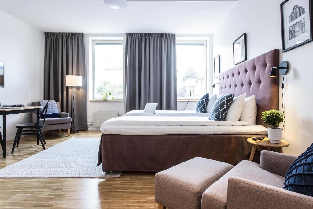 Postel nebo postele na pokoji v ubytování Biz Apartment Solna