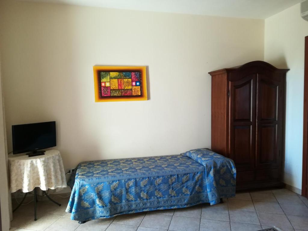 Postel nebo postele na pokoji v ubytování Villa Loreto