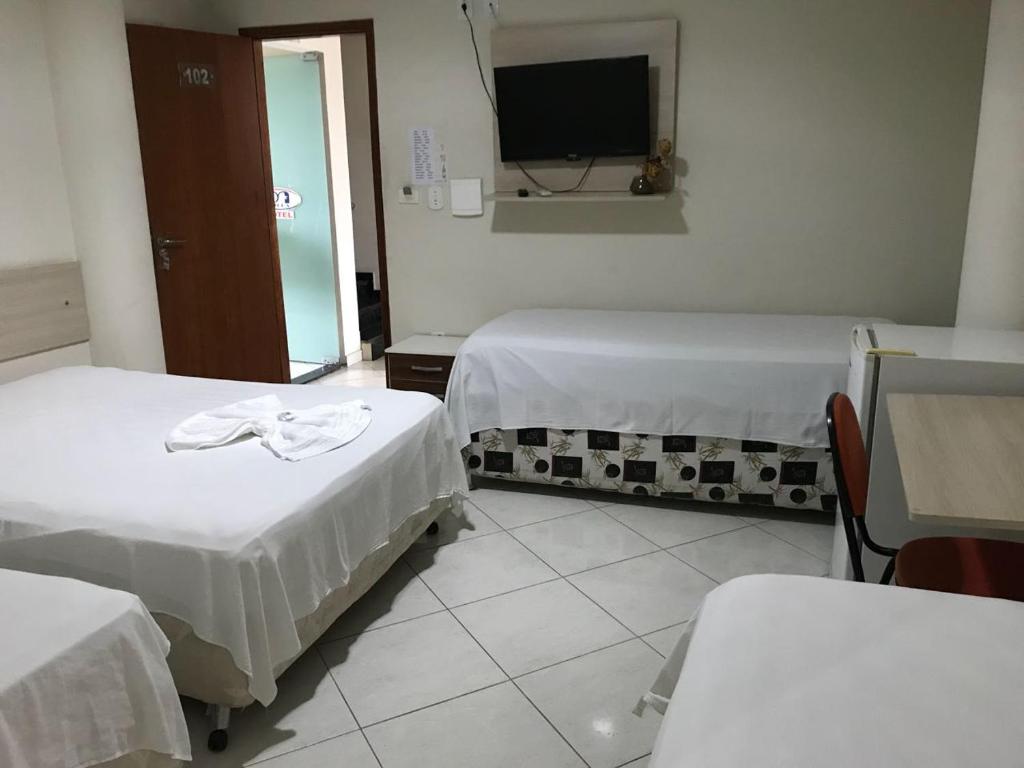 Postel nebo postele na pokoji v ubytování Hotel Milla