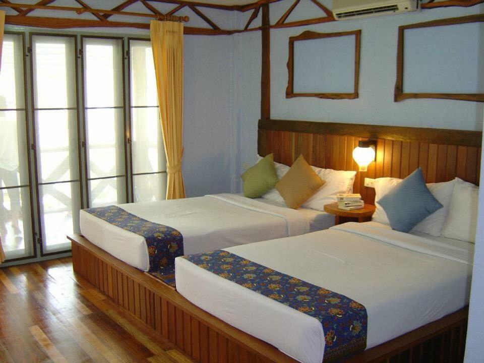 Letto o letti in una camera di Koh Ngai Resort