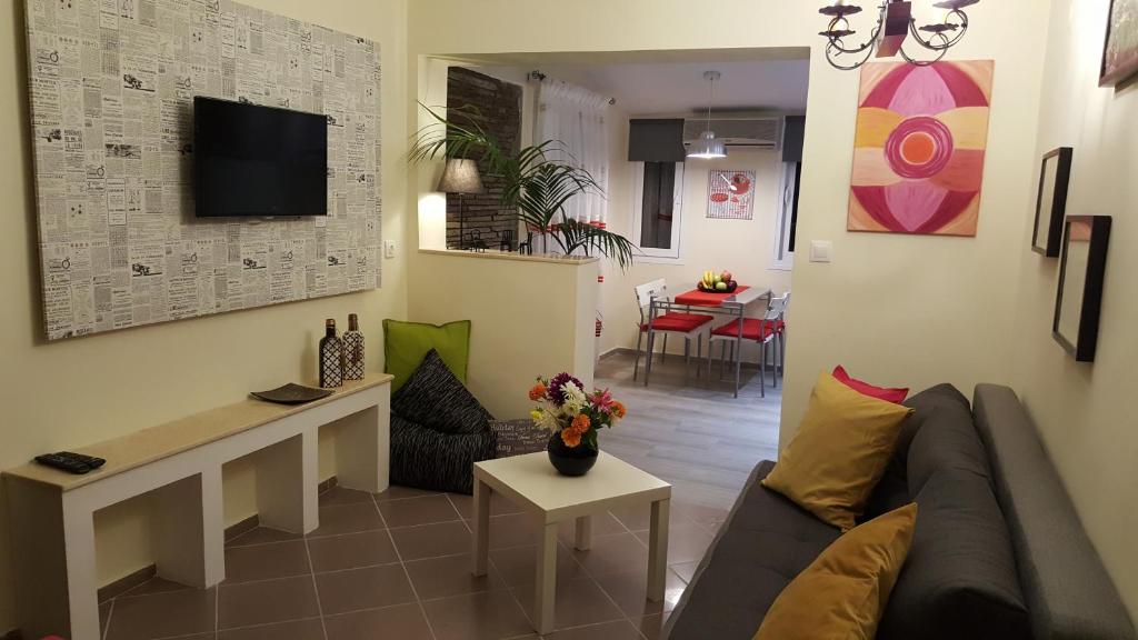 a living room with a couch and a table at City Space Apartments in Giannitsa