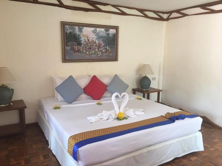 Letto o letti in una camera di Koh Ngai Resort