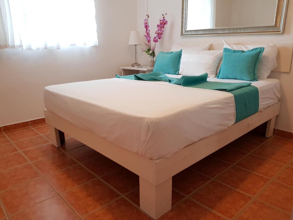 Postel nebo postele na pokoji v ubytování Bayahibe Guest House Hotel