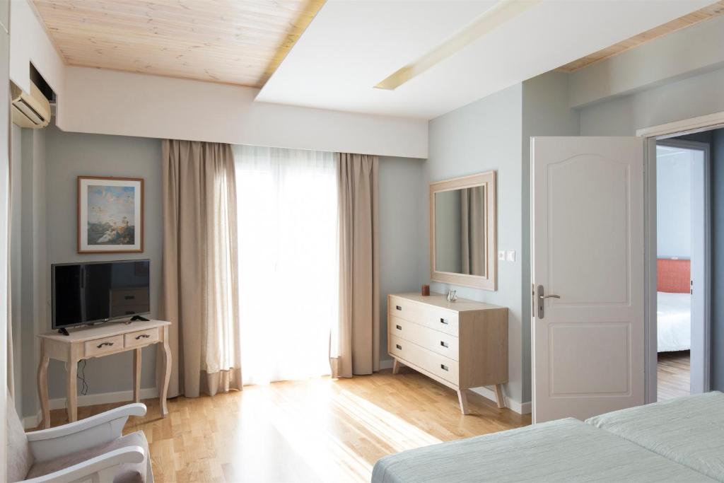 Televízia a/alebo spoločenská miestnosť v ubytovaní Virginia Seaside Villas