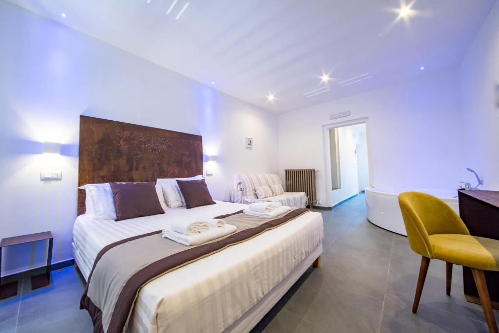 Postel nebo postele na pokoji v ubytování Hotel Assisivm Antica Dimora AD