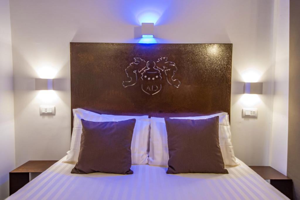 Postel nebo postele na pokoji v ubytování Hotel Assisivm Antica Dimora AD