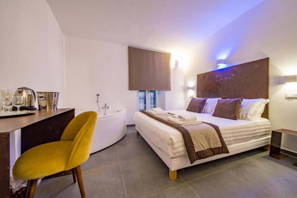 Postel nebo postele na pokoji v ubytování Hotel Assisivm Antica Dimora AD