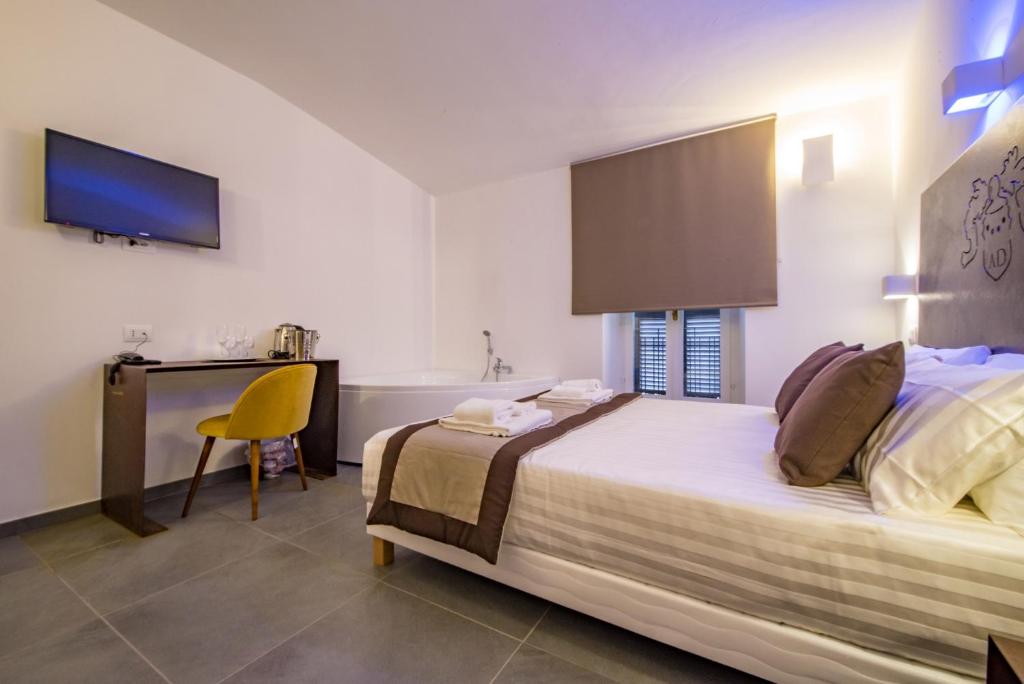Postel nebo postele na pokoji v ubytování Hotel Assisivm Antica Dimora AD