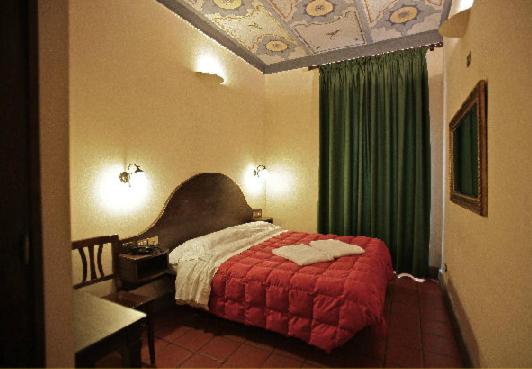 Postel nebo postele na pokoji v ubytování Hotel Panda