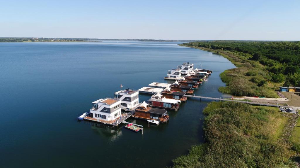 an aerial view of a dock with boats in the water at Goitzsche Resort in Bitterfeld