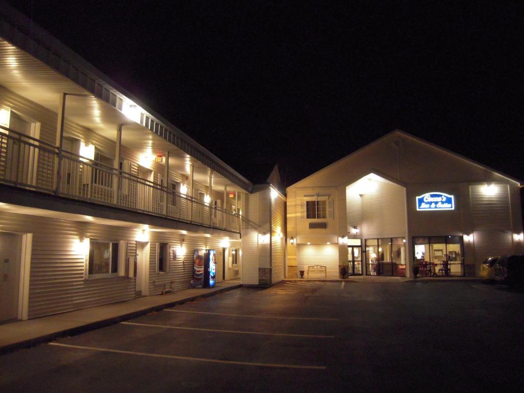 a parking lot in front of a hotel at night at Super 8 by Wyndham Albany in Albany