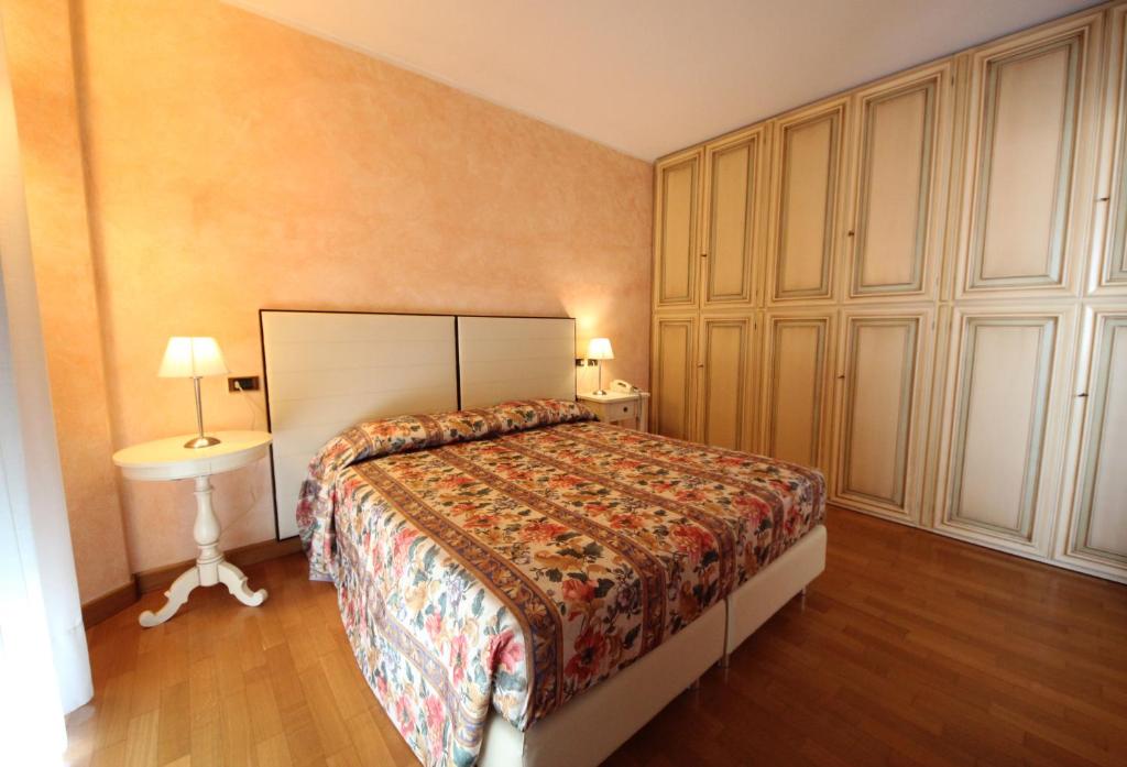 Postel nebo postele na pokoji v ubytování Ruhl Beach Hotel & Suites