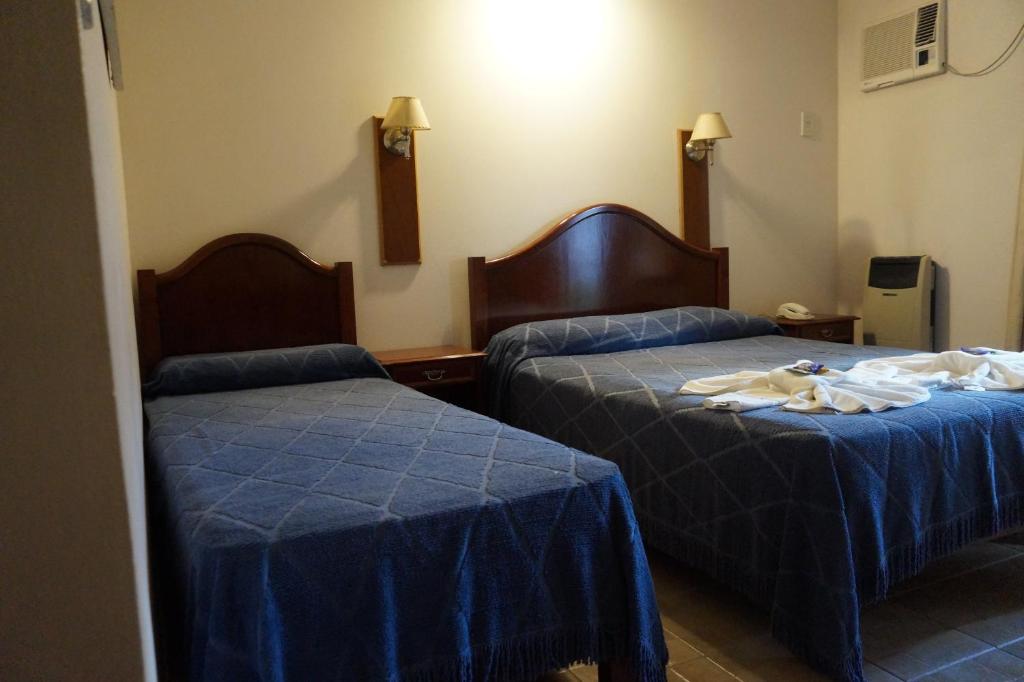Postel nebo postele na pokoji v ubytování Rio Apart Hotel