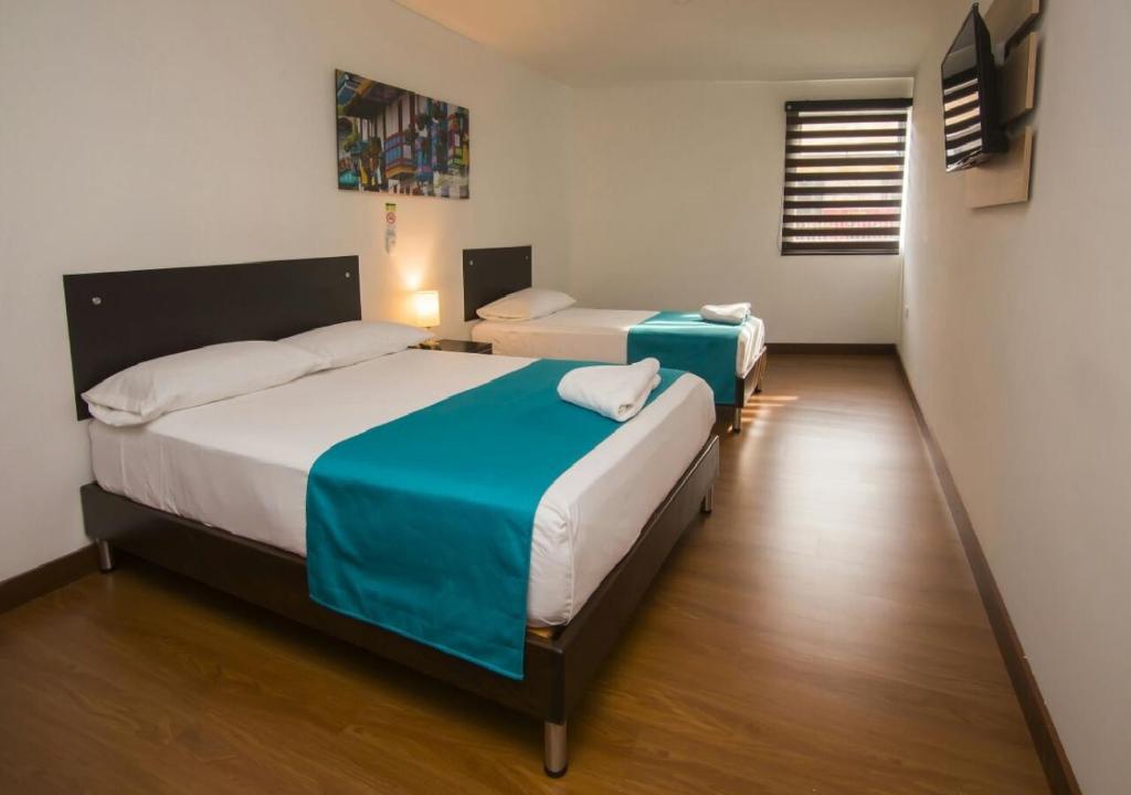 Postel nebo postele na pokoji v ubytování Hotel Valle de San Nicolas