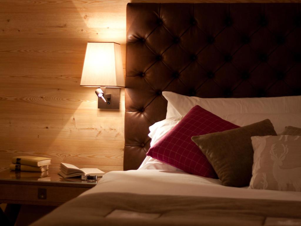 Postel nebo postele na pokoji v ubytování Hotel Royal