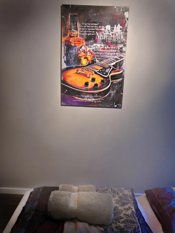 Postel nebo postele na pokoji v ubytování Banshill Apartment