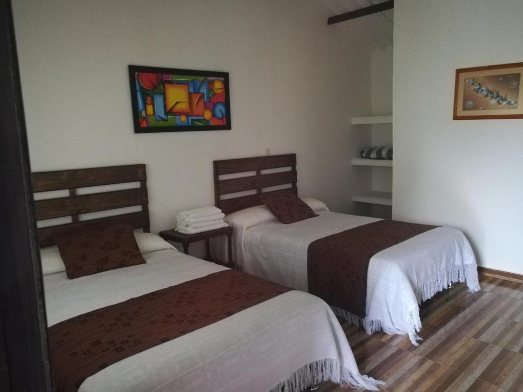 Postel nebo postele na pokoji v ubytování Hotel Campestre El Refugio de Balsora