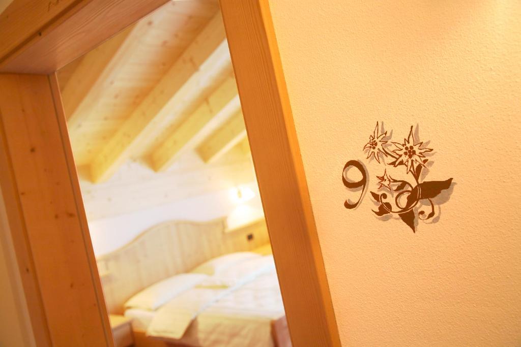 Postel nebo postele na pokoji v ubytování Garnì Prà Fiorì