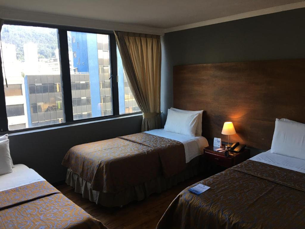 Postel nebo postele na pokoji v ubytování Hotel San Francisco de Asís