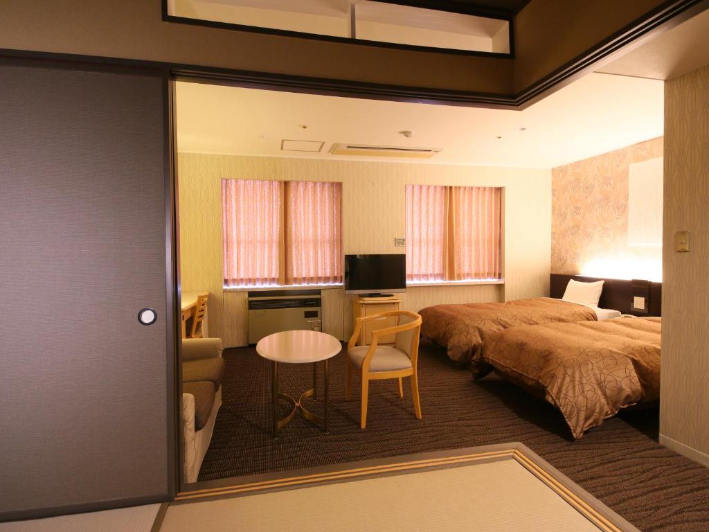Postel nebo postele na pokoji v ubytování Resort Hotel Tateshina