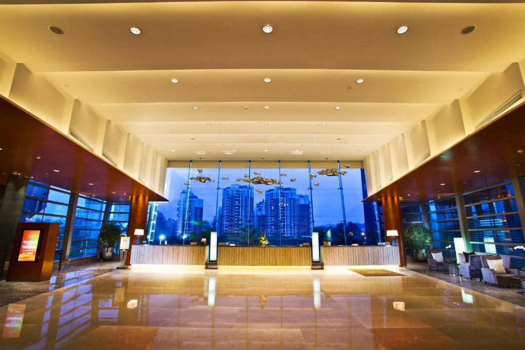 a large lobby with a view of a city at Grand Skylight International Hotel Shenzhen Guanlan Avenue in Bao'an