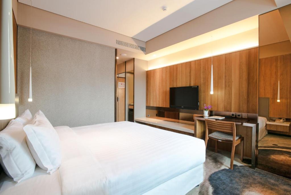 TV a/nebo společenská místnost v ubytování Home Hotel