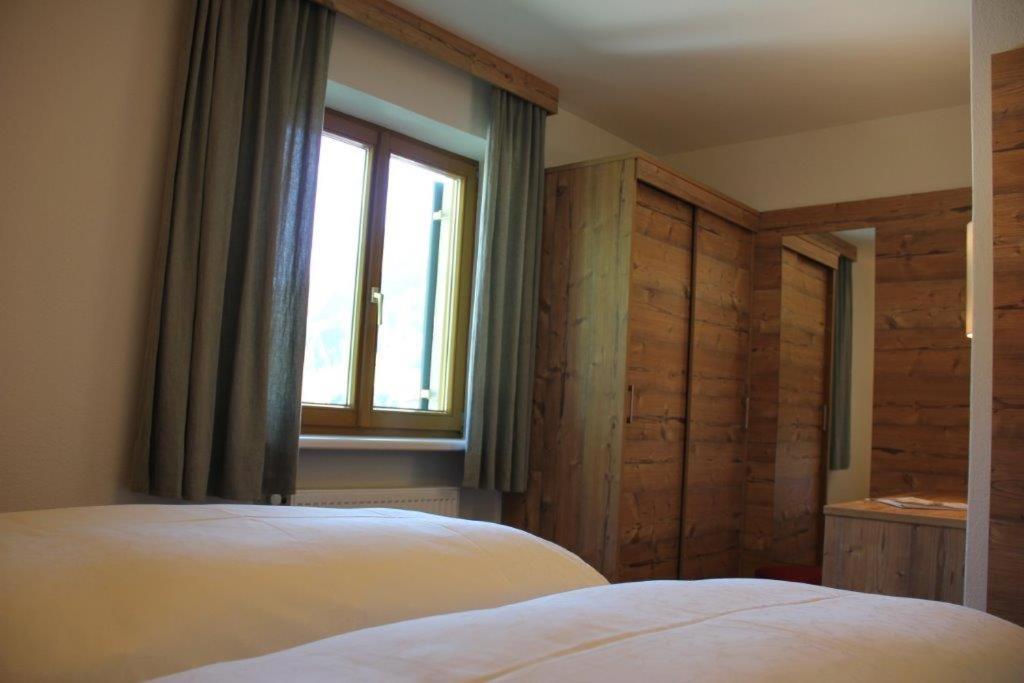 A bed or beds in a room at Haus Biberkopf