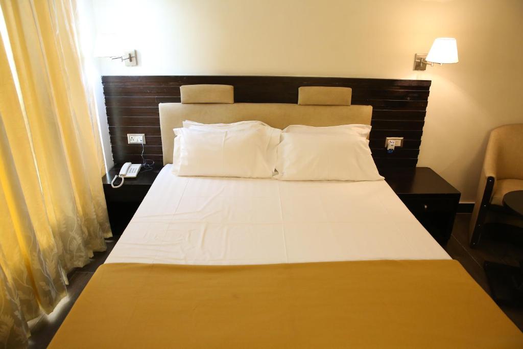 Postel nebo postele na pokoji v ubytování Hotel La Castle