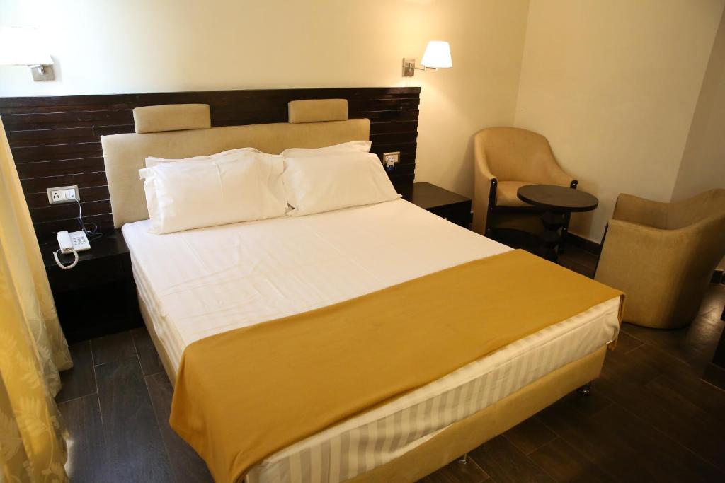 Postel nebo postele na pokoji v ubytování Hotel La Castle