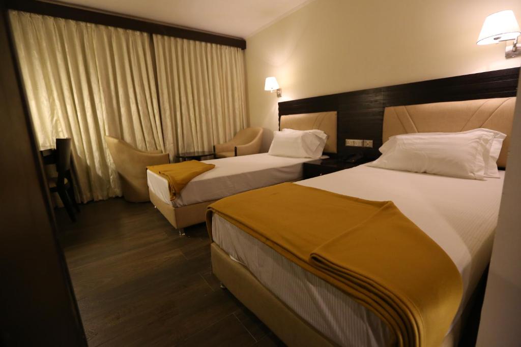 Postel nebo postele na pokoji v ubytování Hotel La Castle