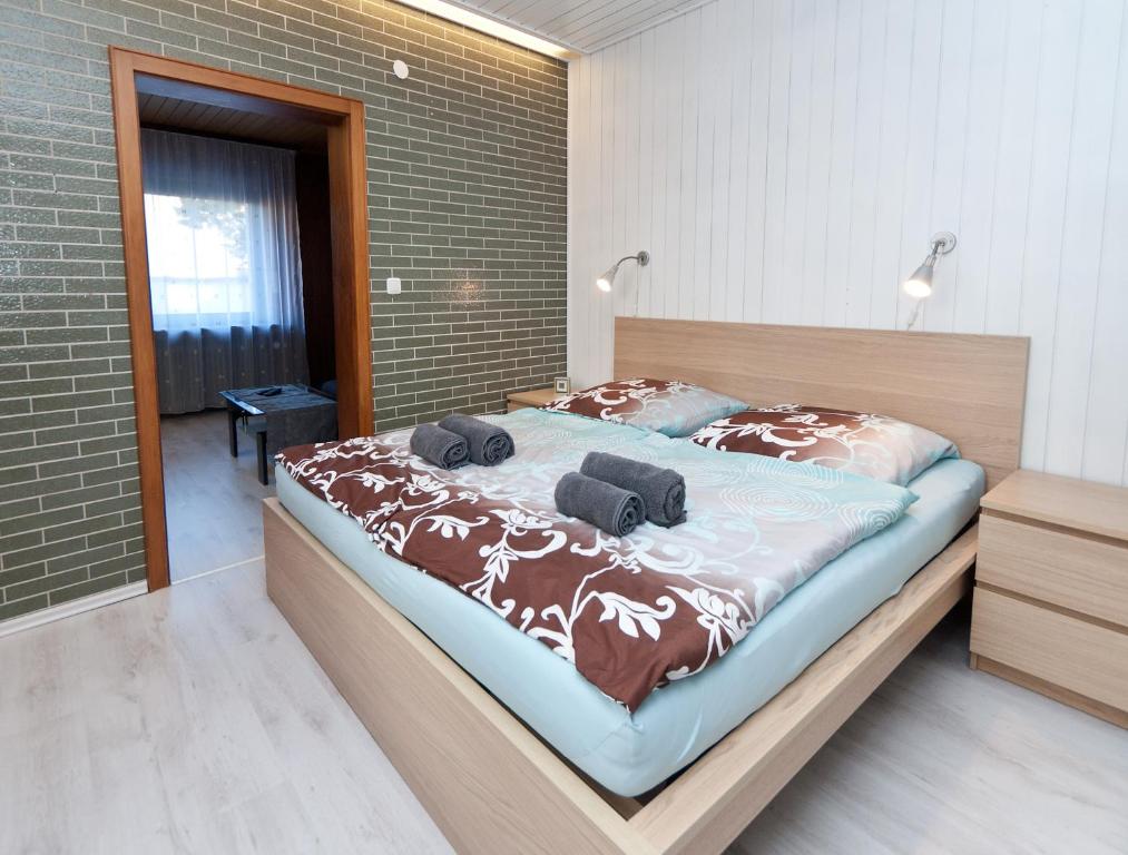 a bedroom with a large bed with two pillows on it at Ferienwohnung Yvonne in Oberhausen