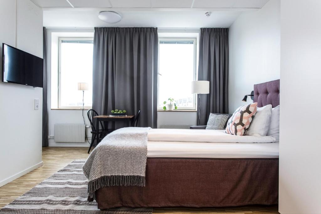 Postel nebo postele na pokoji v ubytování Biz Apartment Solna