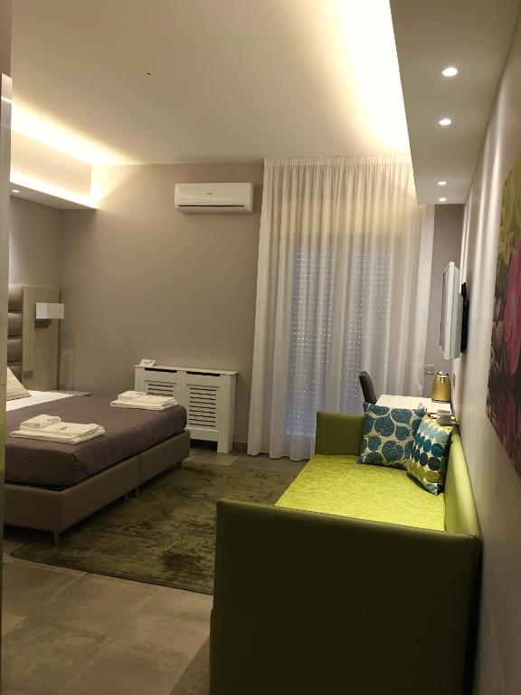 Postel nebo postele na pokoji v ubytování Alludo Aparthotel b&b
