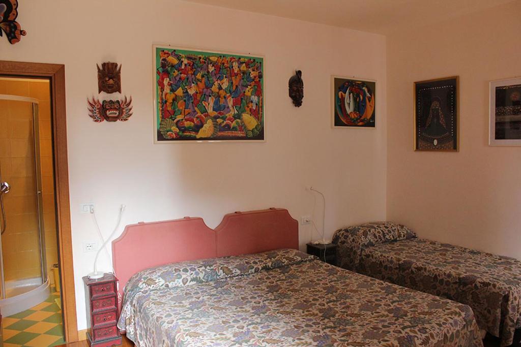 Postel nebo postele na pokoji v ubytování Ciprea Rooms