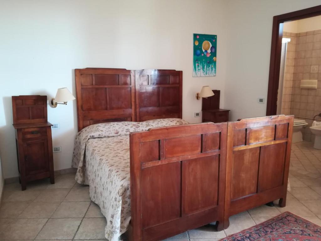 Postel nebo postele na pokoji v ubytování Villa Loreto