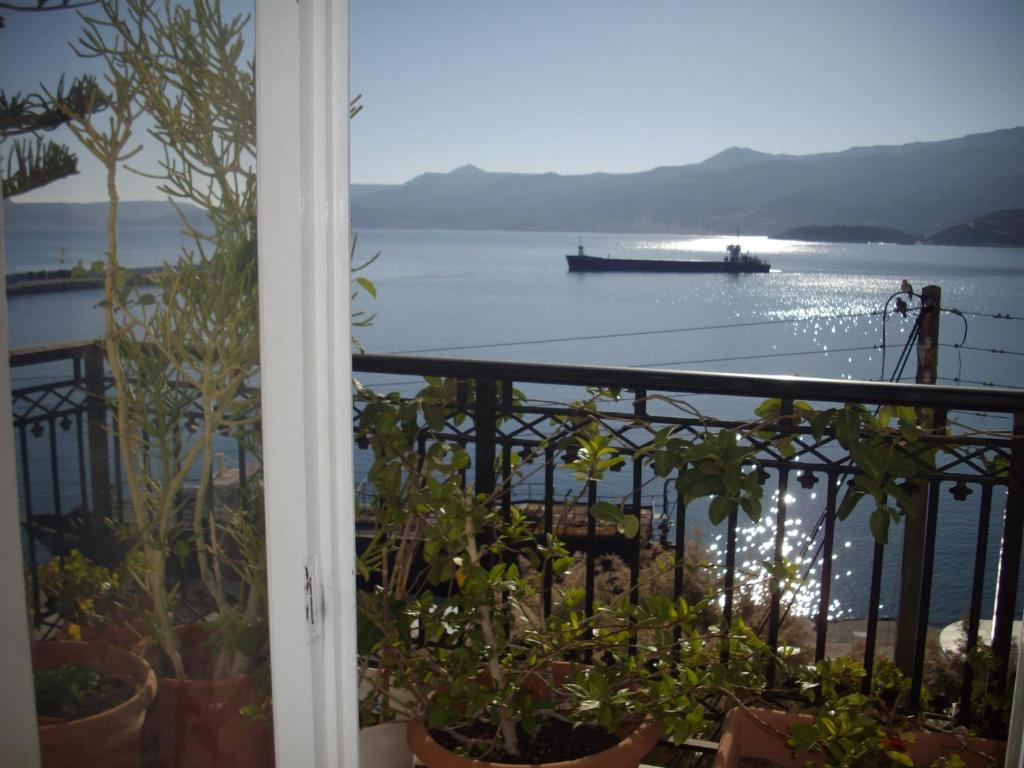 a balcony with a view of the water at Anna in front of the sea Apartment in Sitia