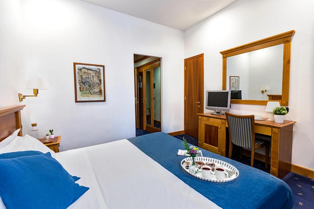 Postel nebo postele na pokoji v ubytování Hotel Diplomatic