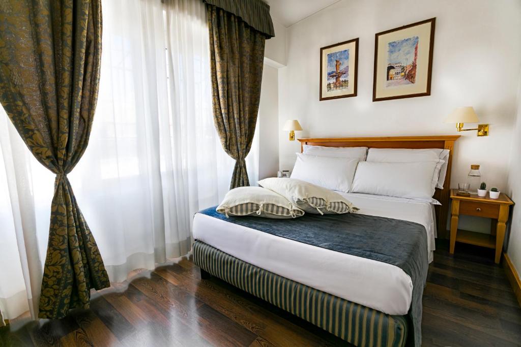 Postel nebo postele na pokoji v ubytování Hotel Diplomatic